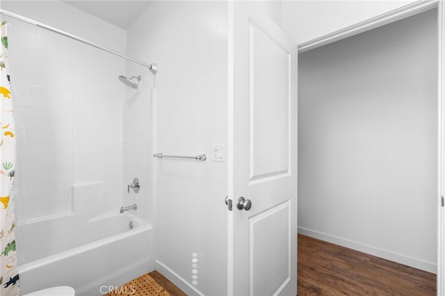 bathroom featuring shower / washtub combination and wood-type flooring