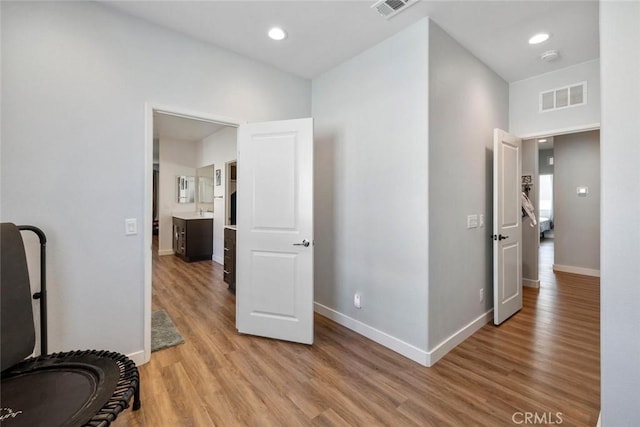 hallway with light wood-type flooring