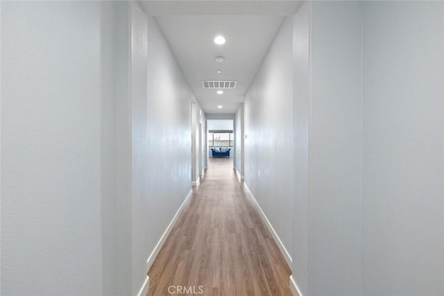 corridor with light wood-type flooring