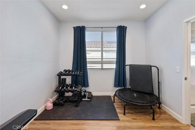 workout area featuring hardwood / wood-style floors