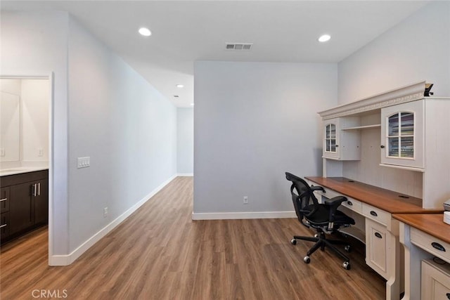 unfurnished office with light hardwood / wood-style flooring