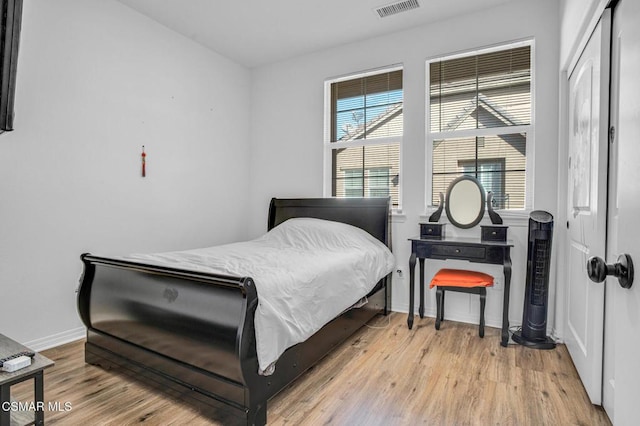 bedroom with light hardwood / wood-style flooring