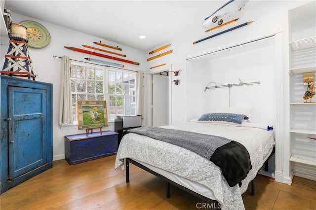 bedroom featuring hardwood / wood-style floors