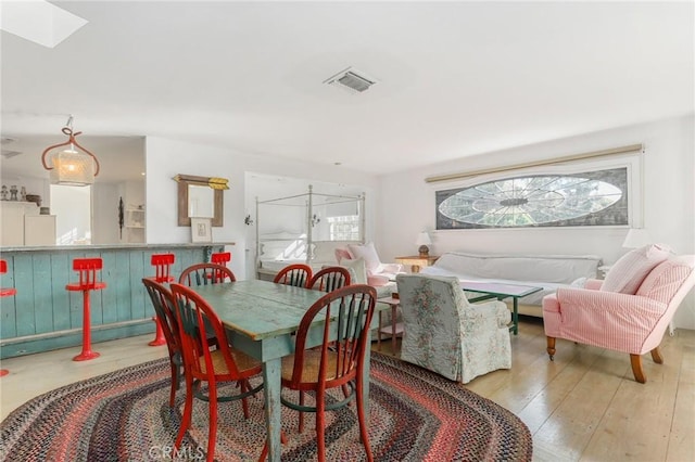 dining room featuring light hardwood / wood-style flooring