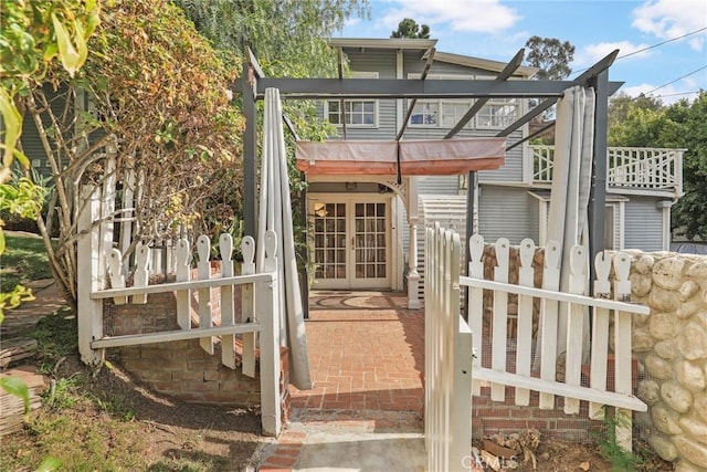 back of house featuring french doors