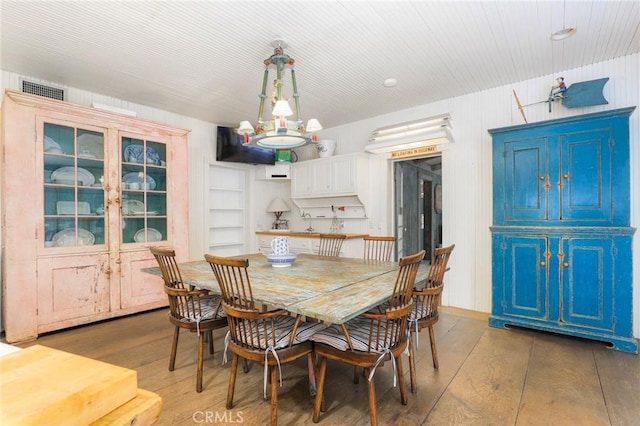 dining space featuring hardwood / wood-style floors