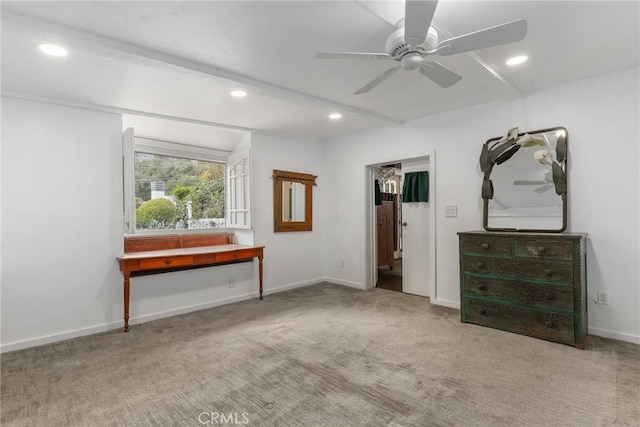 unfurnished bedroom featuring light colored carpet and ceiling fan