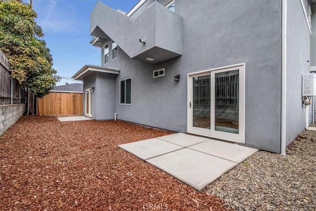 back of property featuring a patio area