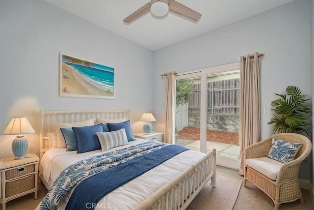 carpeted bedroom featuring ceiling fan and access to exterior