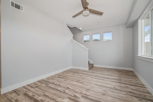 interior space with ceiling fan and light hardwood / wood-style floors