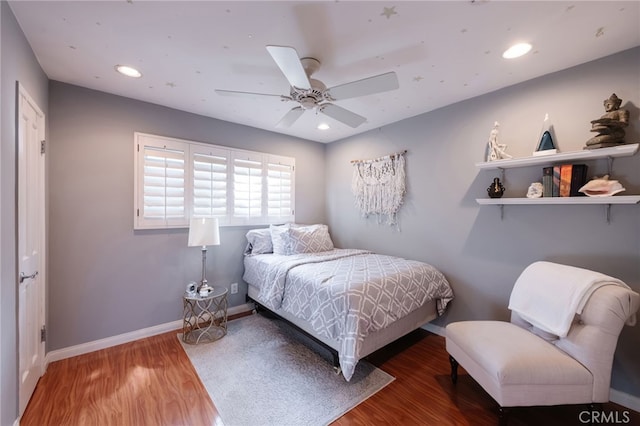 bedroom featuring wood-type flooring and ceiling fan