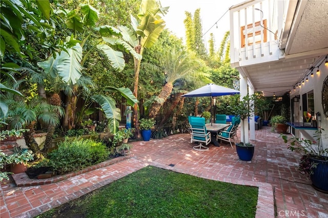 view of patio featuring a balcony