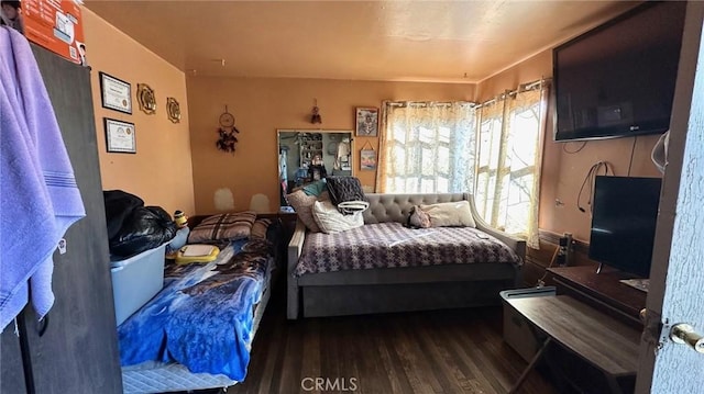 bedroom featuring dark hardwood / wood-style flooring