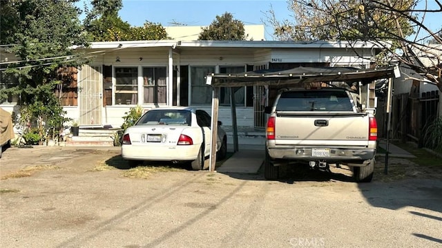 view of front facade with a carport