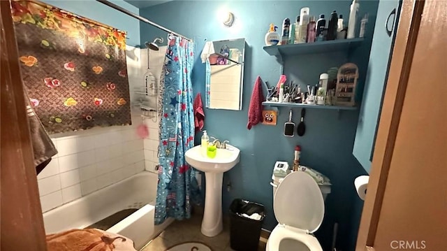 bathroom with shower / tub combo and toilet