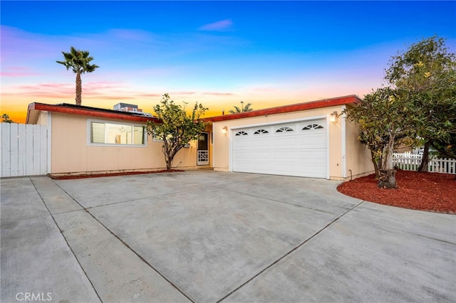 ranch-style house featuring a garage