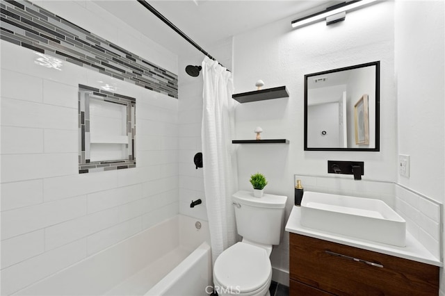 full bathroom with vanity, toilet, and shower / tub combo with curtain