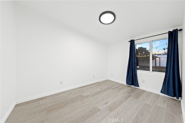 unfurnished room featuring light hardwood / wood-style flooring