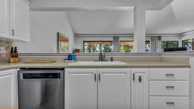 kitchen featuring white cabinetry, lofted ceiling, dishwasher, and sink