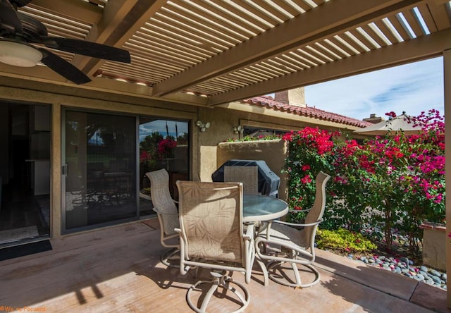 view of patio / terrace featuring ceiling fan and a pergola