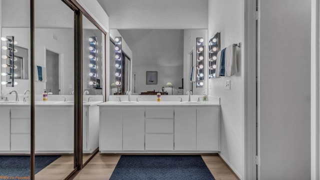 bathroom featuring vanity and wood-type flooring