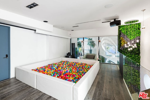 bedroom featuring dark hardwood / wood-style flooring