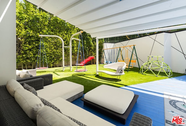 view of patio featuring a playground and outdoor lounge area