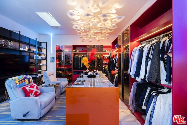 walk in closet featuring a skylight