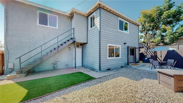 rear view of property with a patio area