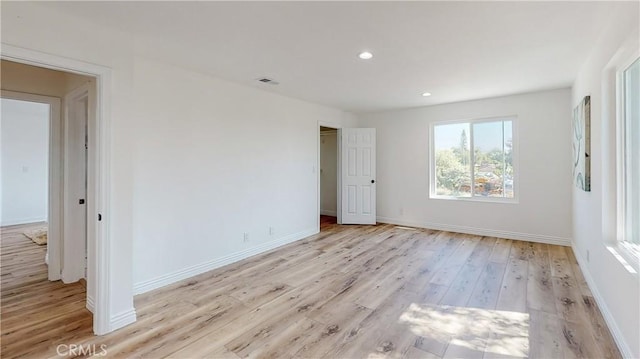 unfurnished bedroom with light hardwood / wood-style floors