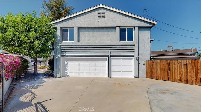 front facade with a garage