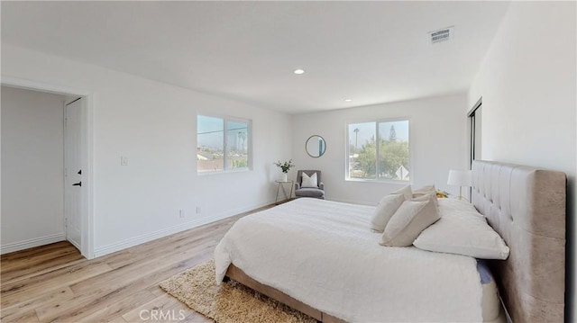 bedroom with light wood-type flooring