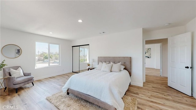 bedroom with light hardwood / wood-style floors