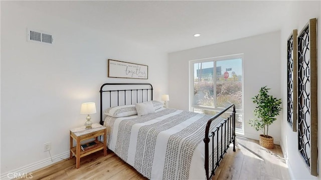 bedroom with light hardwood / wood-style floors