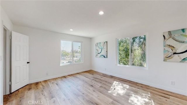 unfurnished room featuring light hardwood / wood-style floors