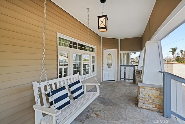 property entrance with covered porch