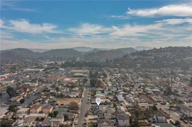 birds eye view of property featuring a mountain view