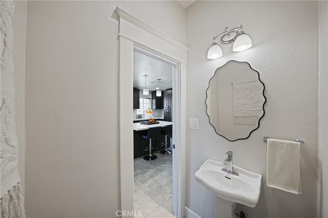 bathroom with tile patterned floors and sink