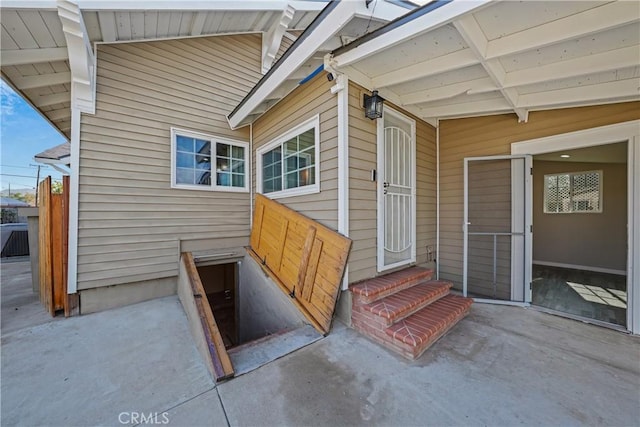 property entrance featuring a patio area