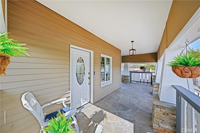 doorway to property with a porch