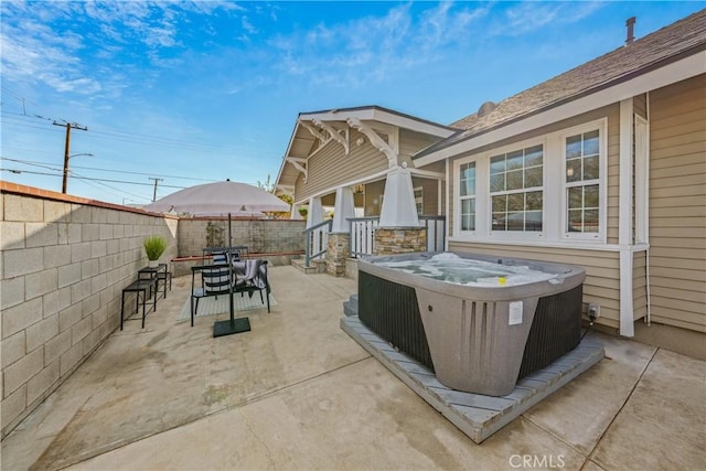 view of patio / terrace featuring a hot tub