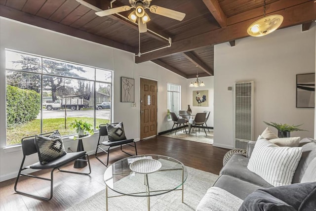 living room with vaulted ceiling with beams, wood ceiling, wood-type flooring, and ceiling fan with notable chandelier