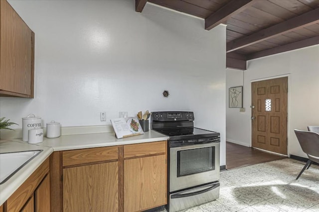 kitchen featuring beam ceiling, electric range, and wooden ceiling