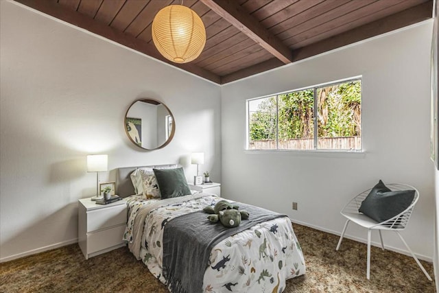 carpeted bedroom featuring wood ceiling and beamed ceiling