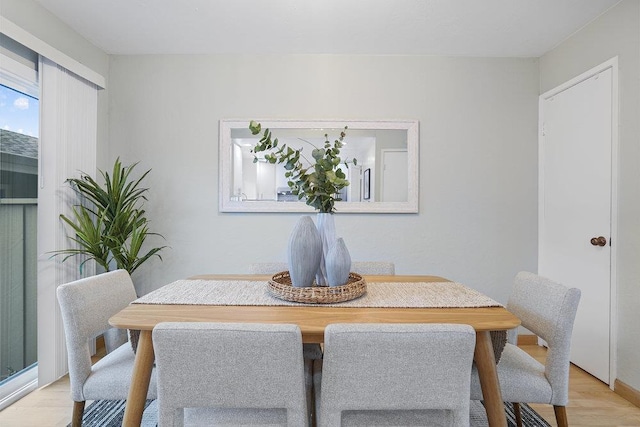 dining room with light wood-type flooring