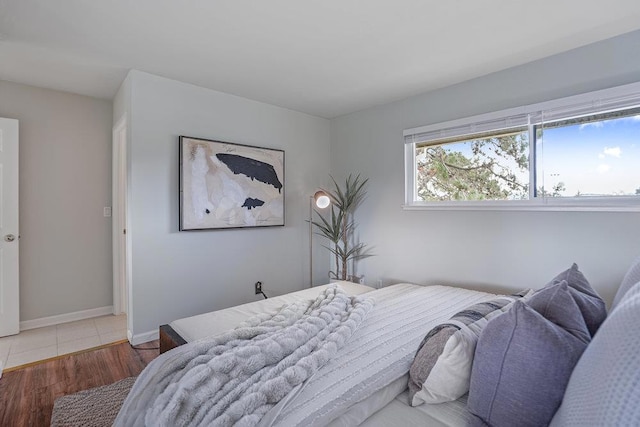 bedroom with hardwood / wood-style floors