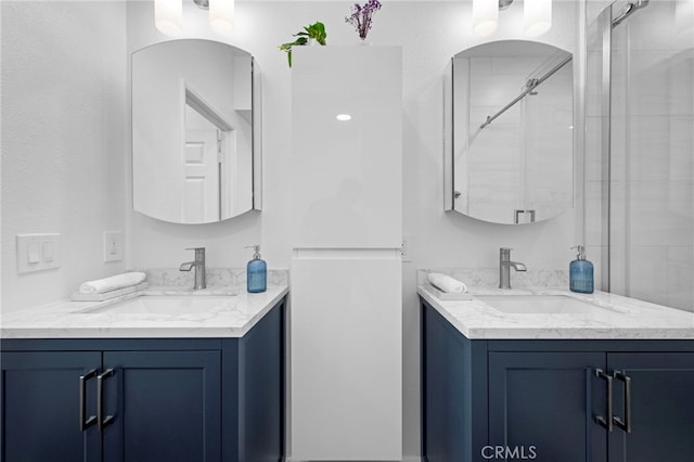 bathroom with vanity and an enclosed shower