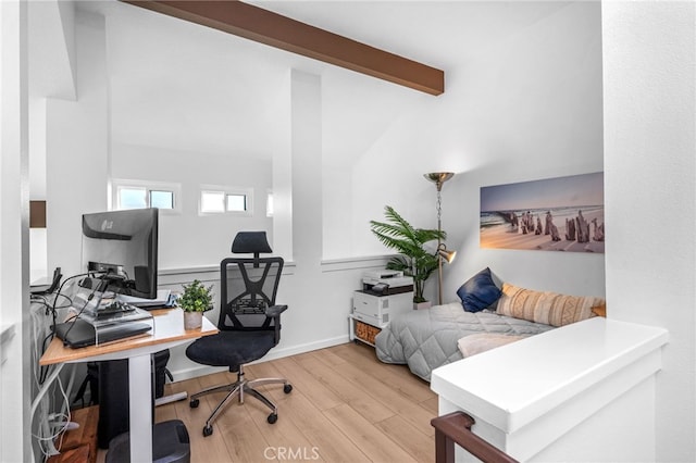 office space featuring beam ceiling and light hardwood / wood-style floors