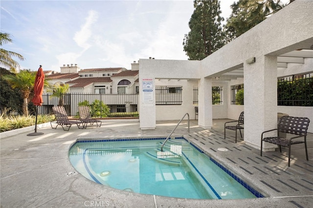 view of swimming pool featuring a patio