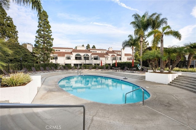 view of pool featuring a patio